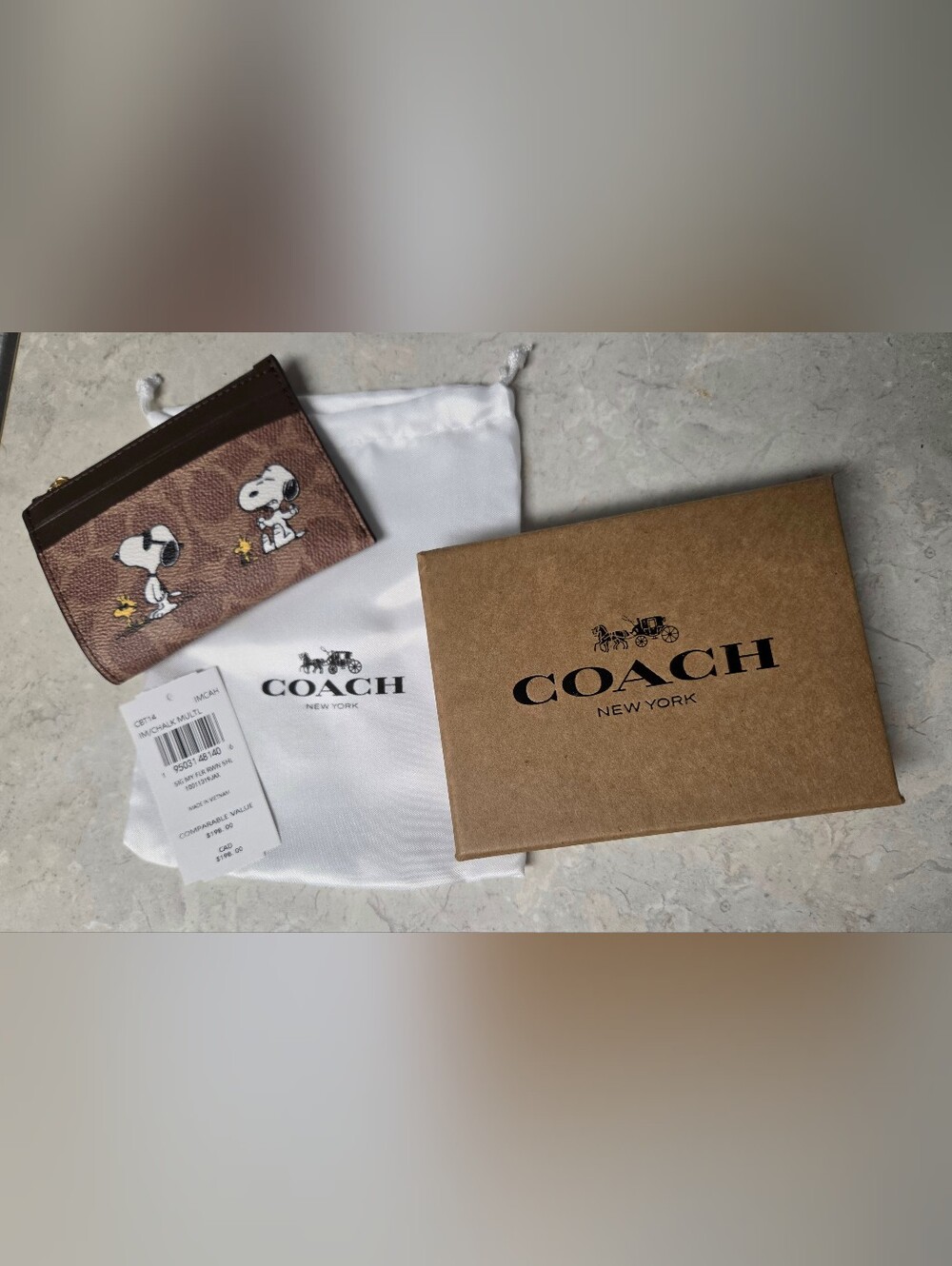 Coach Coach X Peanuts Mini Skinny Id Case In Signature Canvas with Snoopy Print